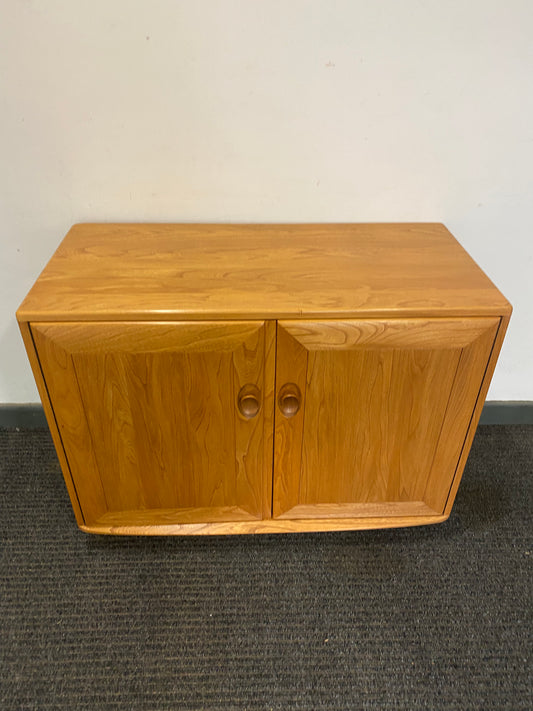 Ercol 2 door cabinet #1013 solid elm. Excellent condition.